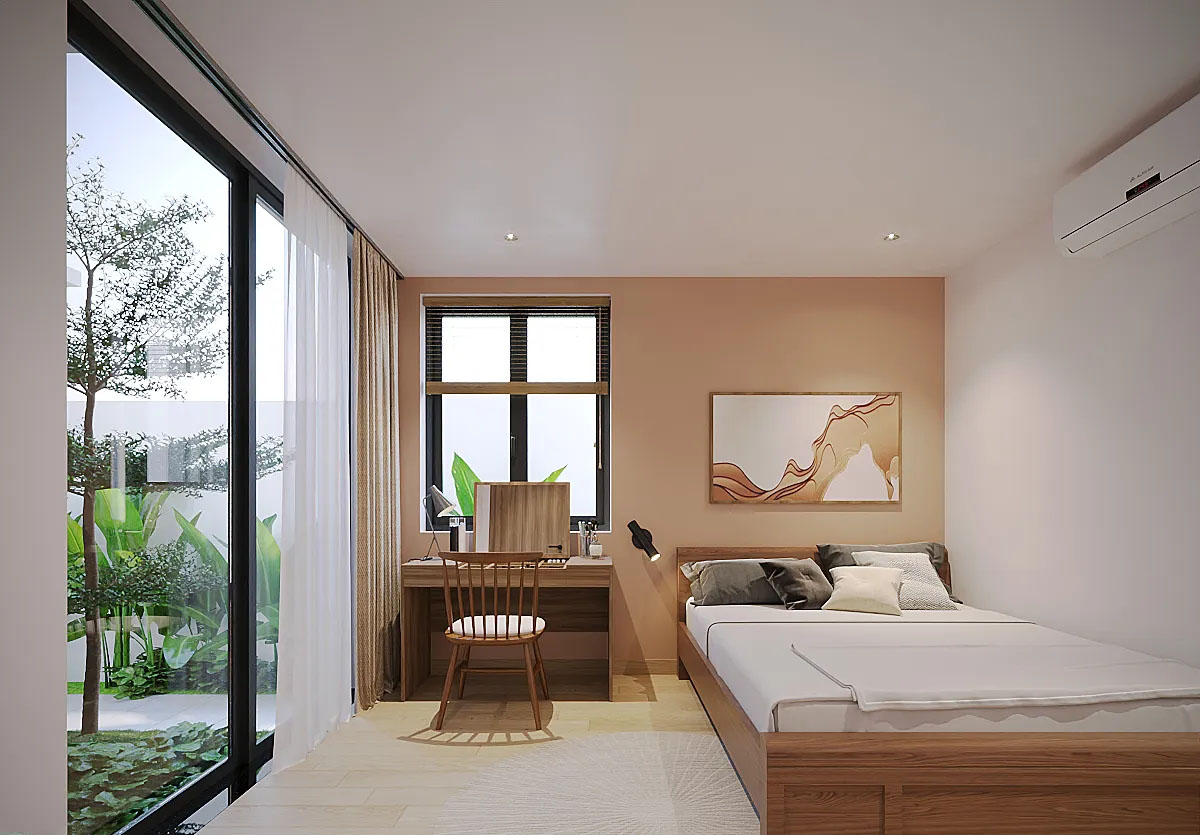 Phòng ngủ tầng 1 đối diện nhau được ngăn cách bởi một khoảng sân nhỏ với cây xanh